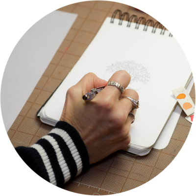 Annette Frei Designs creating a logo by hand